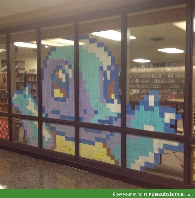 My school library likes to make Post-it note art. This is their latest creation