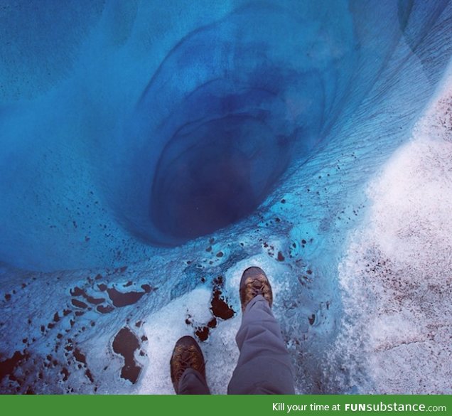 1000 ft hole found at Lower Ruth Glacier in Alaska covered only by a sheet of clear ice