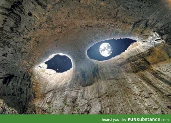 View of the moon from inside a cave
