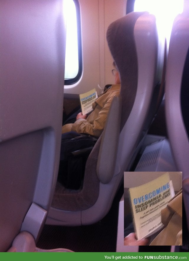 Woman asleep on train