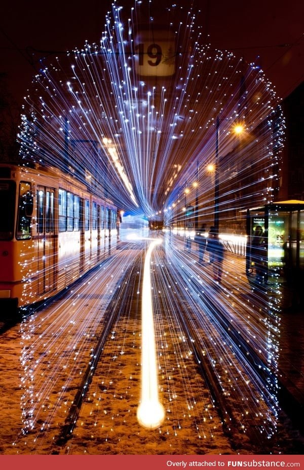 Long exposure of a departing Tram in Budapest covered with 30,000 LEDs