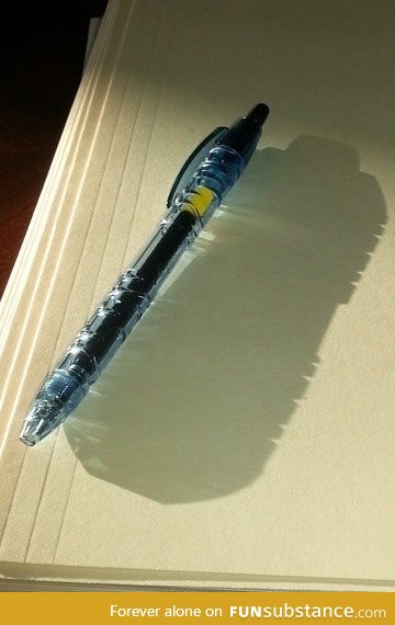 Pen made of recycled water bottles casts a shadow of a water bottle
