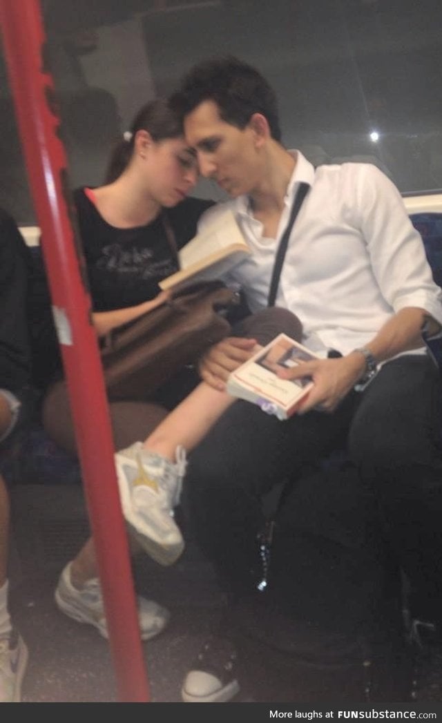 A wonderful shot for a woman reading a book for her blind husband
