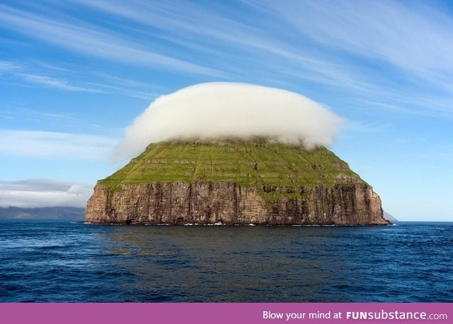 The cloud covered island of Litla Dimun, the largest uninhabited Faroe Island