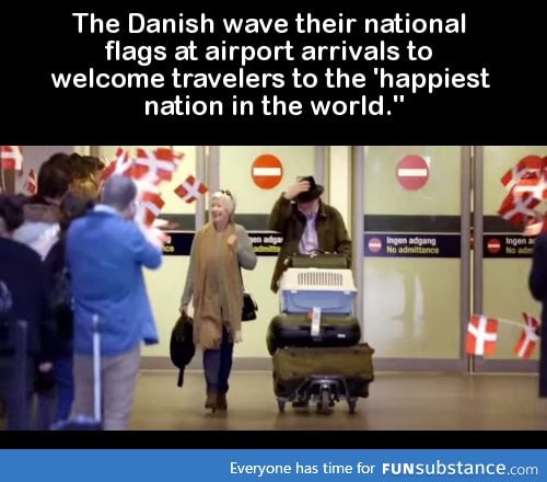 The Danish wave their national flags at airport arrivals to welcome travelers