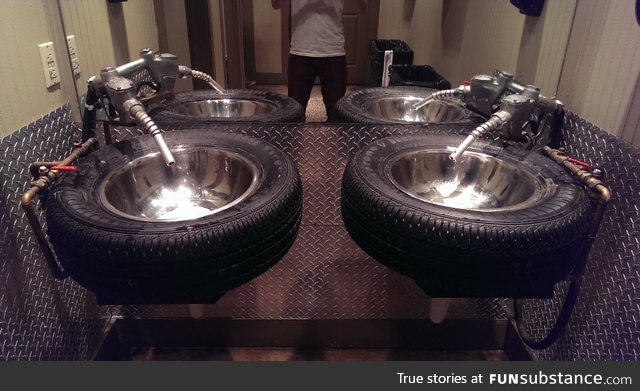 These sinks are tires (and their faucets are gas pumps)