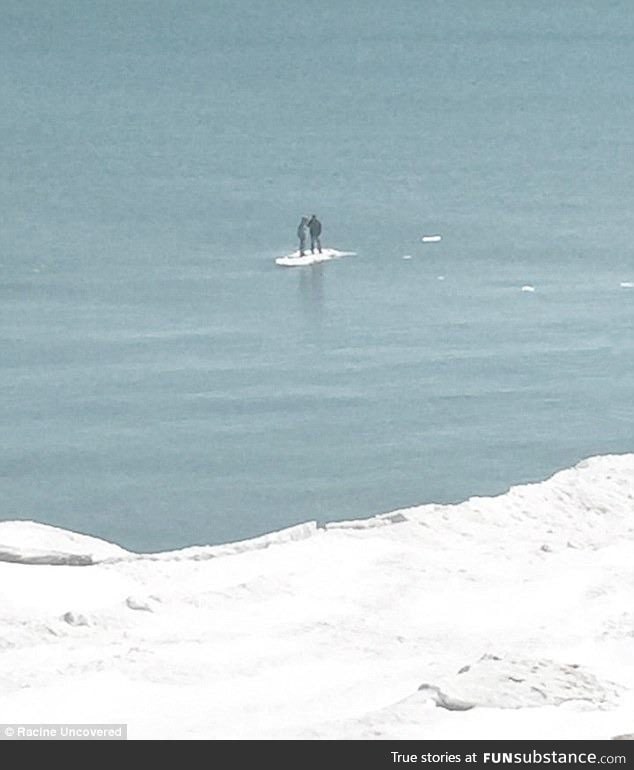 Teenagers floating away on a tiny iceberg on Lake Michigan