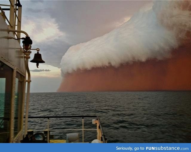 Incredible sight forms when dust storm and rain clouds combine over Indian ocean