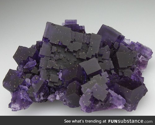 Fluorite. It looks like a slice of the night sky