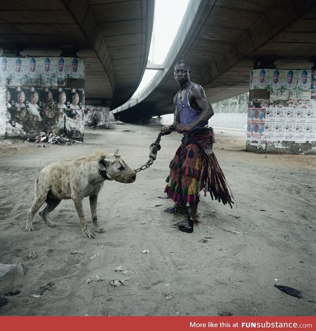 Nigerian dude with his pet hyena