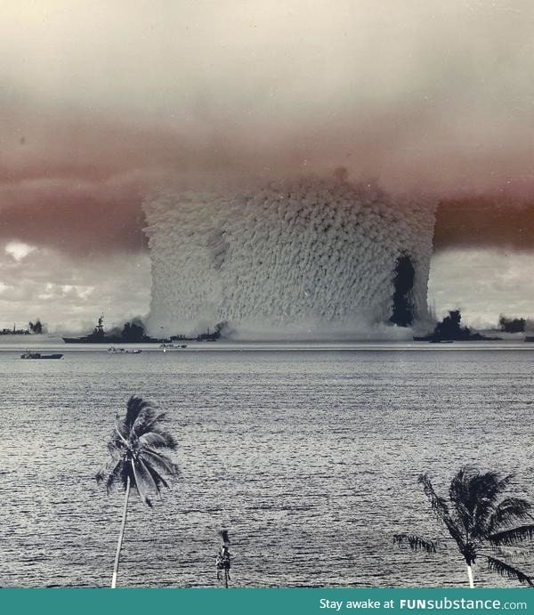 Massive column of water rises from the ocean as an Atomic Bomb detonates at Bikini Atoll