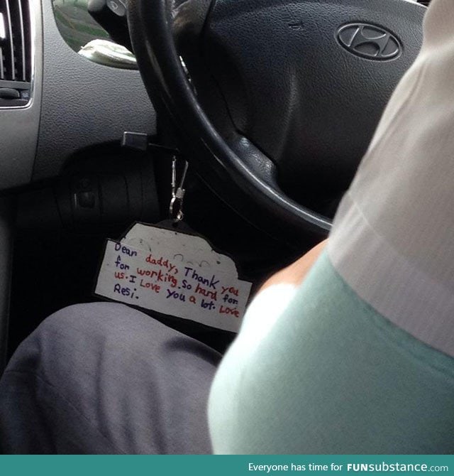 A note hanging from this taxi driver's steering wheel