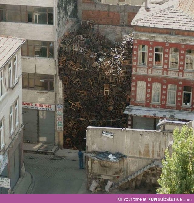 These chairs in between two buildings