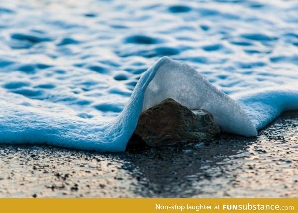 Seafoam splash captured at a thousandth of a second