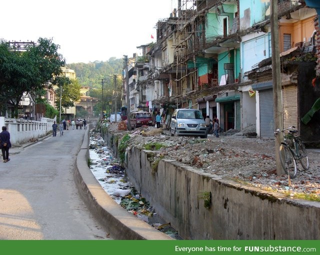 This is the border between India and Bhutan. India is on the right