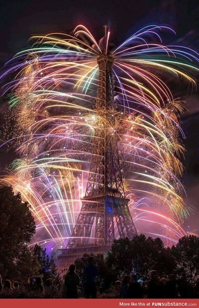 The Eiffel Tower smothered by fireworks on Bastille Day