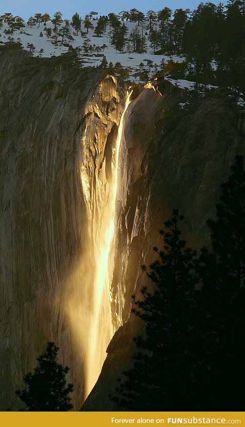 Once a year, the sun hits Yosemite's waterfalls just right to make it light up like this