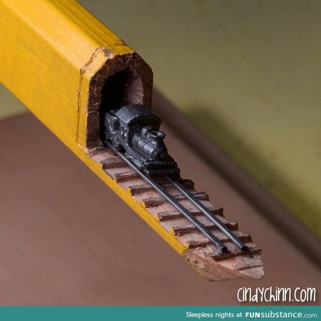 Train carved into the lead of a carpenters pencil... 3/16'th of an inch highBy