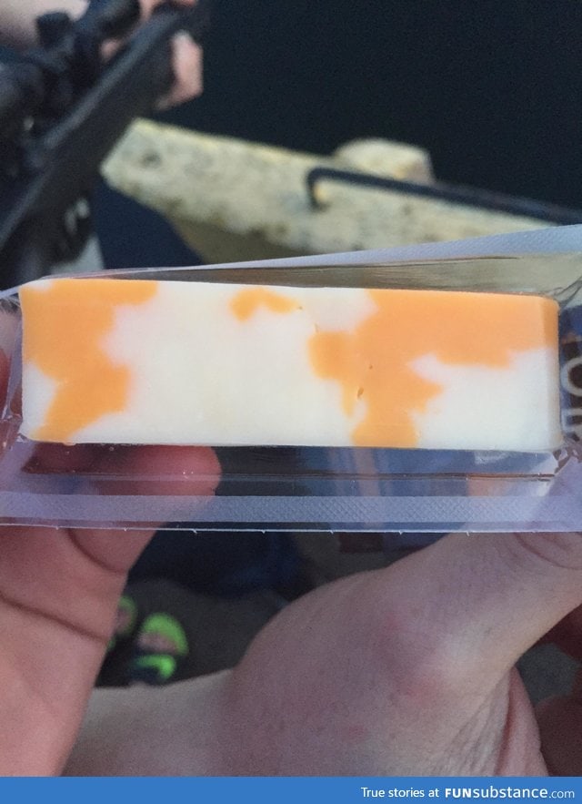 This block of cheese has a very, very crude map of the world on it
