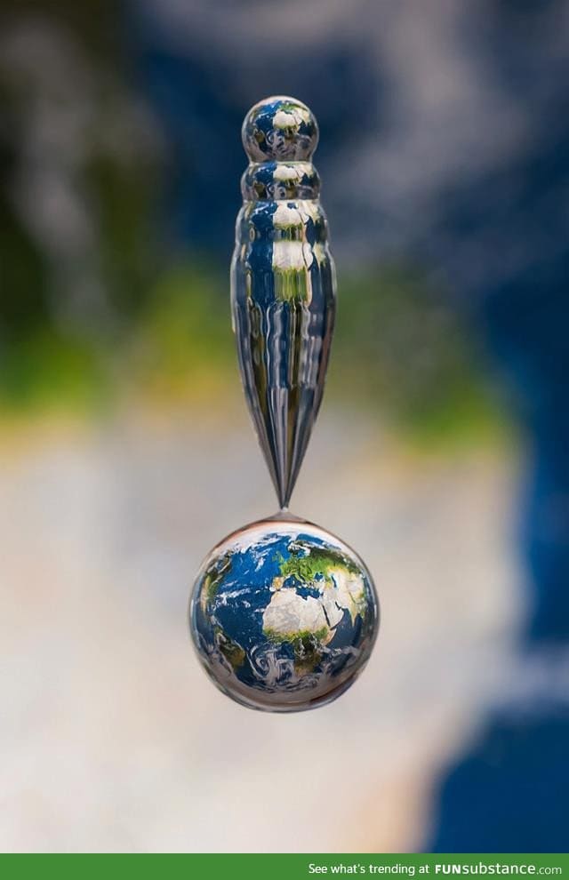 Picture of a water droplet above a map