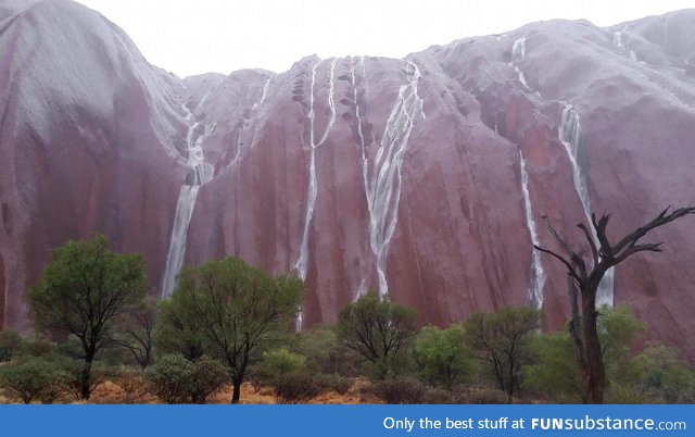 Rain running down Uluru