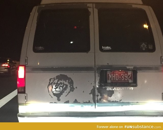 The bad paint on the van is scratched off to look like a lion