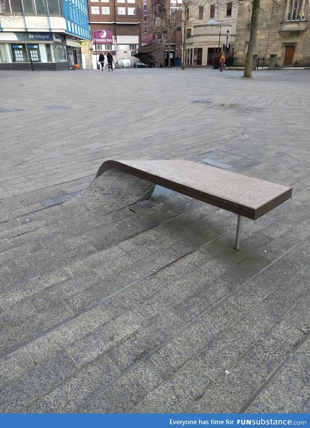 This paving stone curls into a bench to sit on