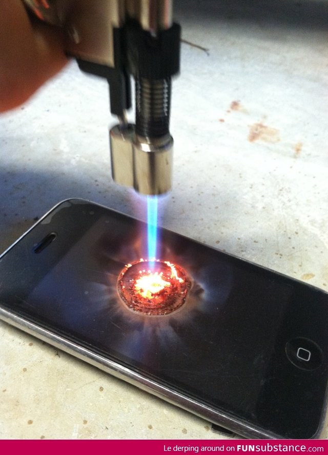 An iPhone being burned with a butane lighter