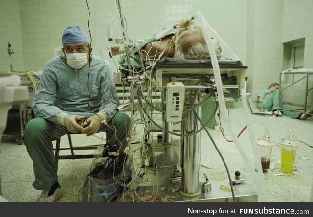 Heart surgeon and his assistant after 23 hour surgery