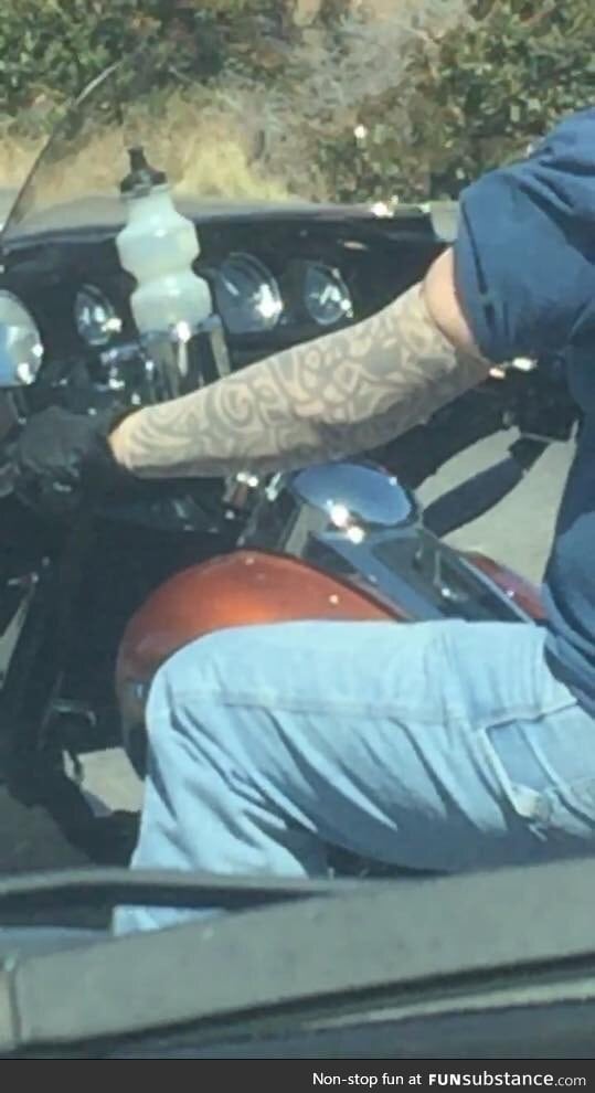 Guy on his Harley wearing fake tattoo sleeves haha