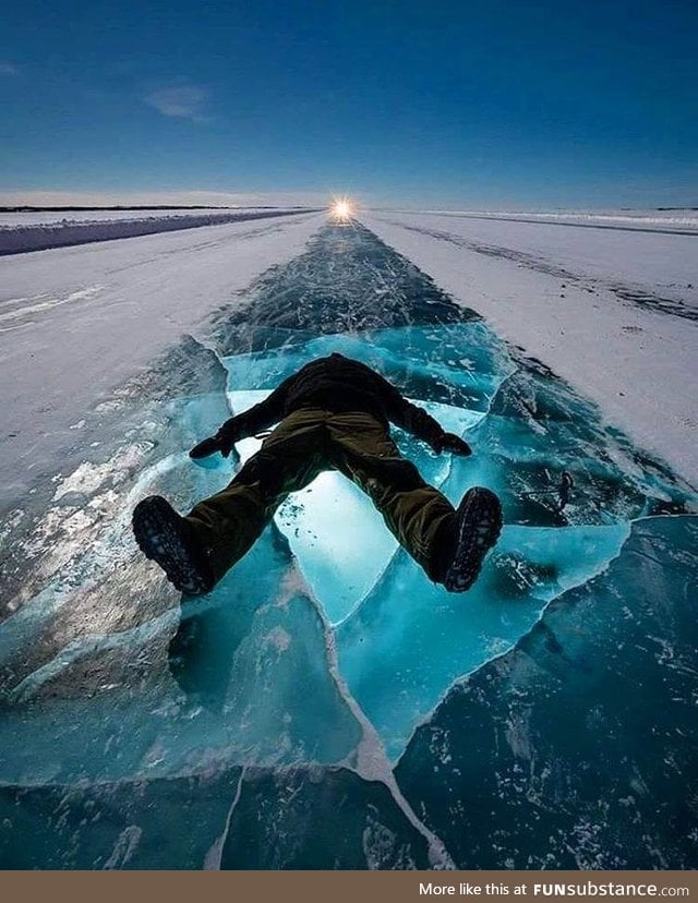 Dude chilling out on the Dettah Ice Road, Yellowknife, Canada