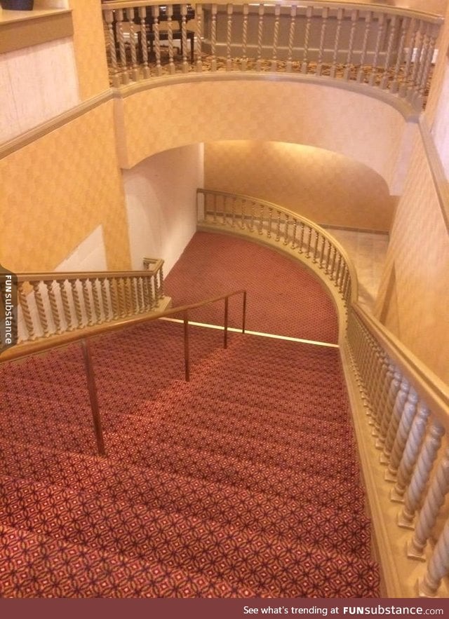 This fancy staircase leads directly into a wall