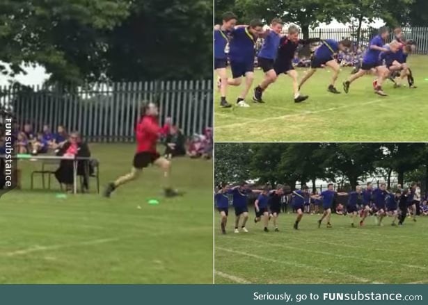 Little boys link arms whilst racing to let the kid with Down's Syndrome (in red) win.