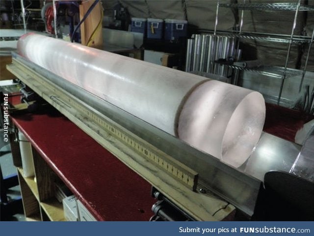 Ice core from Antarctic Ice. The dark band is a layer of volcanic ash