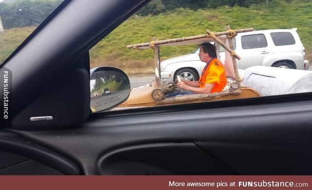 Someone is driving around the freeway in Vancouver washington in the flintstone car