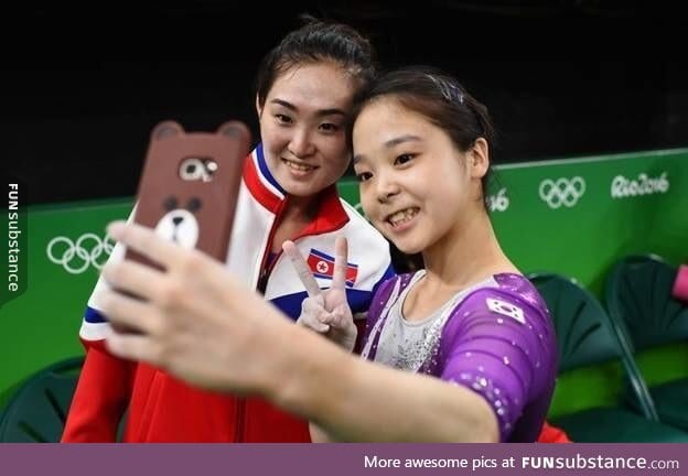 Gymnasts from North & South Korea take a selfie together. This is why we do the olympics