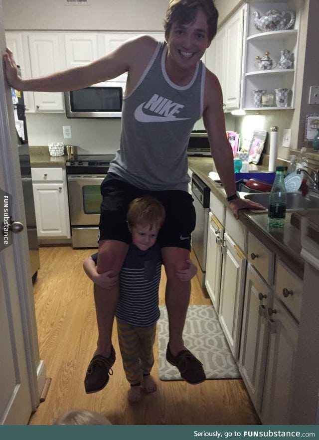 Kid thinks he's lifting his uncle up