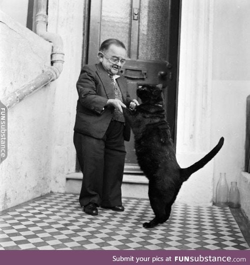 Smallest man in the world dancing with his pet cat