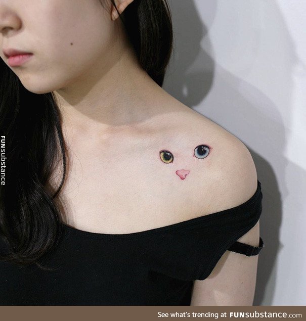 Minimalistic cat tattoo
