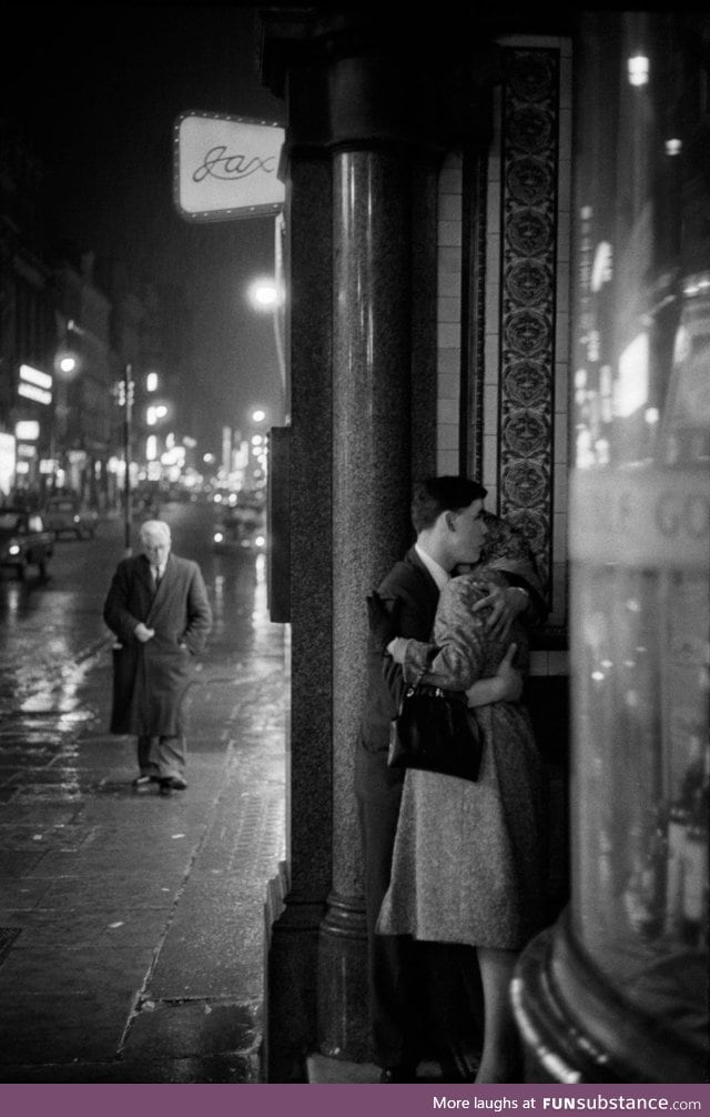 A rainy night in Oxford Street, London, 1960. Photograph by Philip Jones Griffiths.