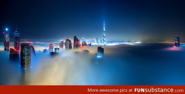 Dubai covered in fog by night