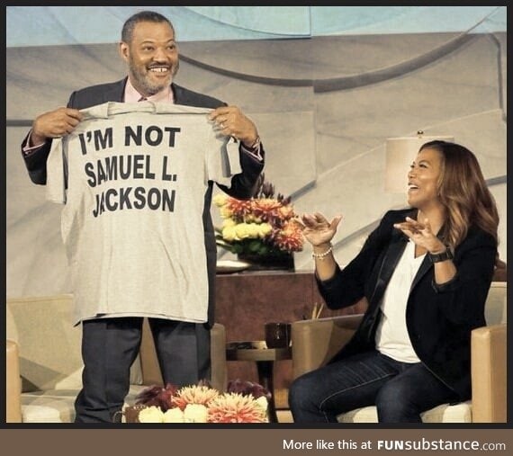 Denzel Washington showing off his new t-shirt gifted to him by Tyra Banks