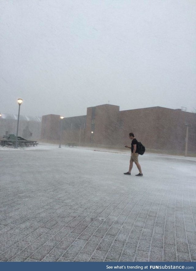 A guy at a University in Canada walking to class