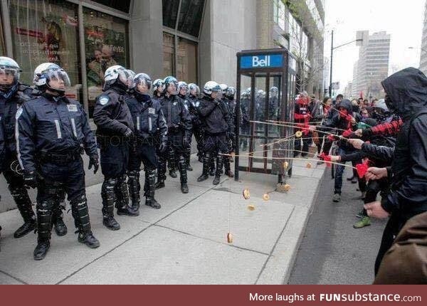 Montreal students protesters baiting riot police with donuts