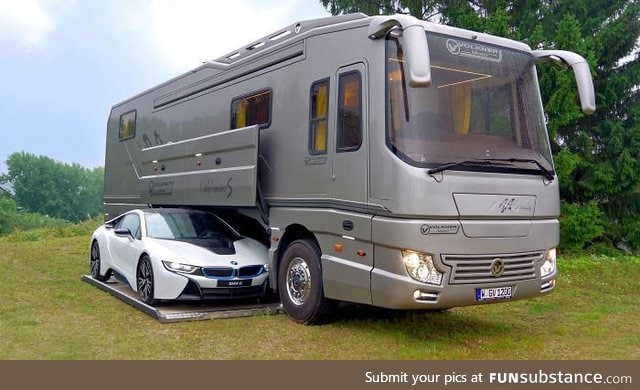 This $1.7 million motor home with its own garage may look like an ordinary bus until...