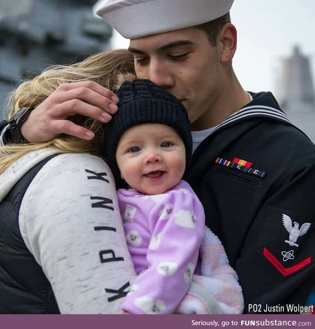 Ridiculously photogenic baby meets her dad for the first time