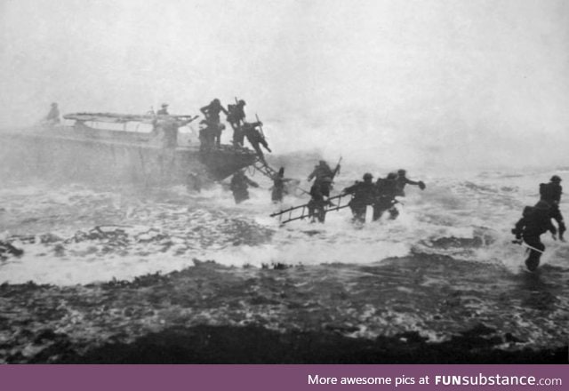 This pic is not photoshopped, there really is a guy charging the beaches in the D-day