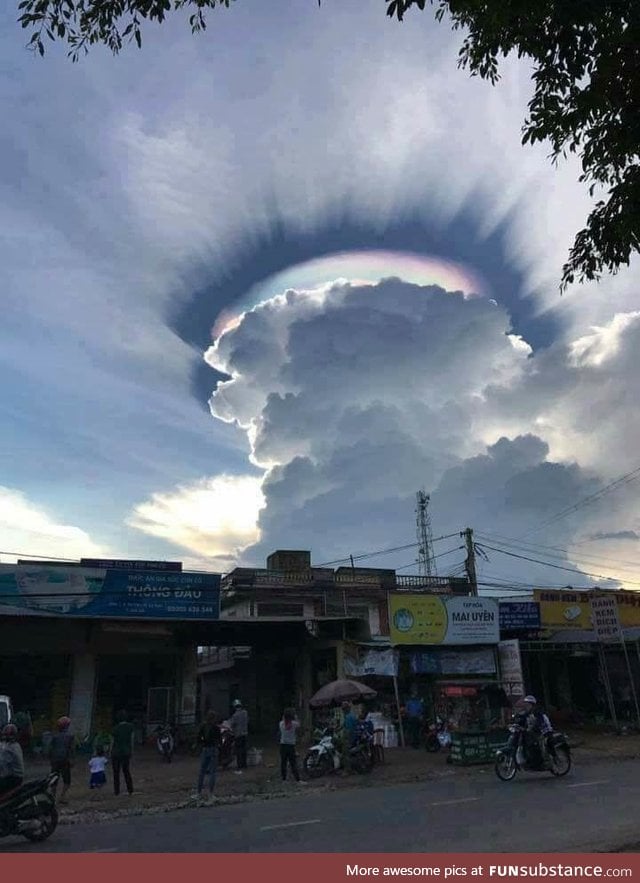Giant cumulus cloud with iridescence