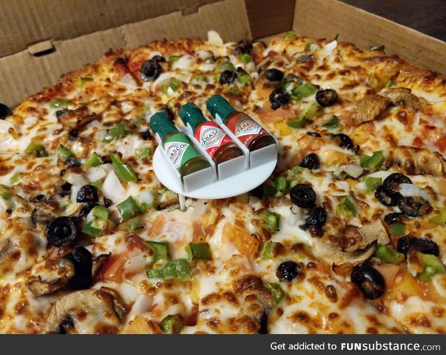 This tabasco tray on a pizza