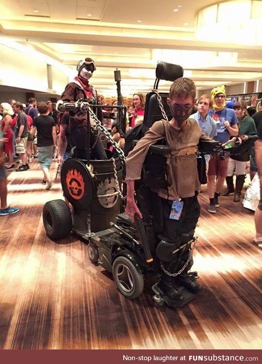Kid with disability uses it to his advantage as a mad max cosplay